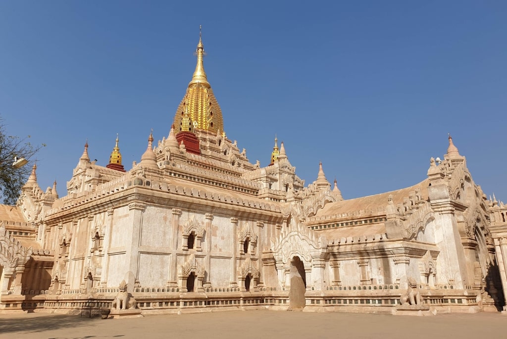 “Tourist riding e-bike through Bagan temple ruins”
